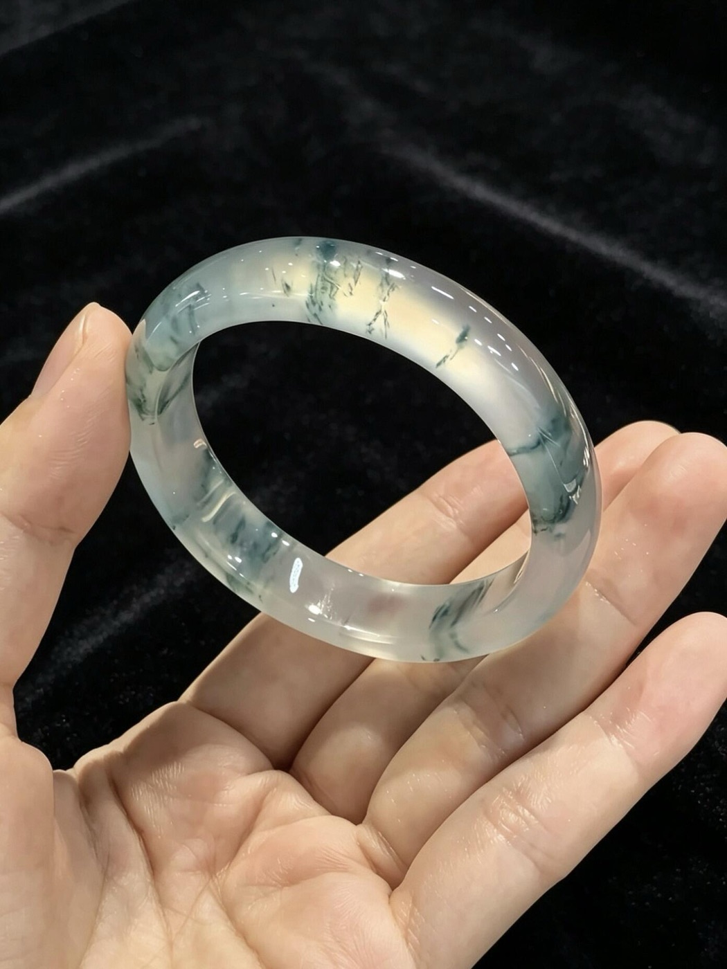 A Rissdon Jade bangle showing its internal floating pattern